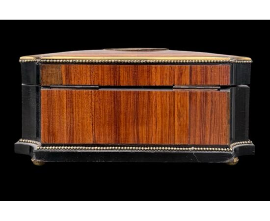 Inlaid wood box with geometric motifs.