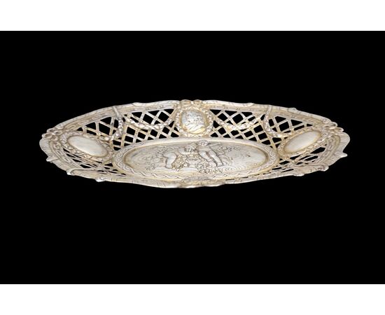 Pierced silver centerpiece with putti and figures. Holland.