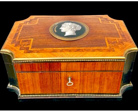 Inlaid wood box with geometric motifs.