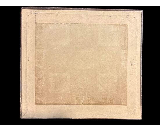 Framed panel with vase of flowers embroidered on fabric.