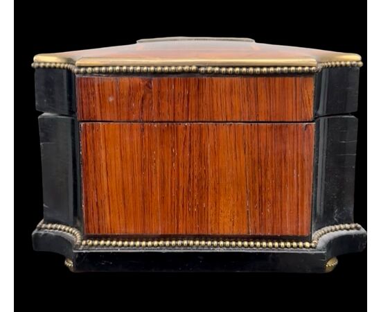 Inlaid wood box with geometric motifs.