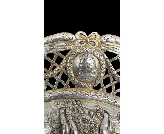 Pierced silver centerpiece with putti and figures. Holland.