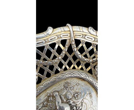 Pierced silver centerpiece with putti and figures. Holland.