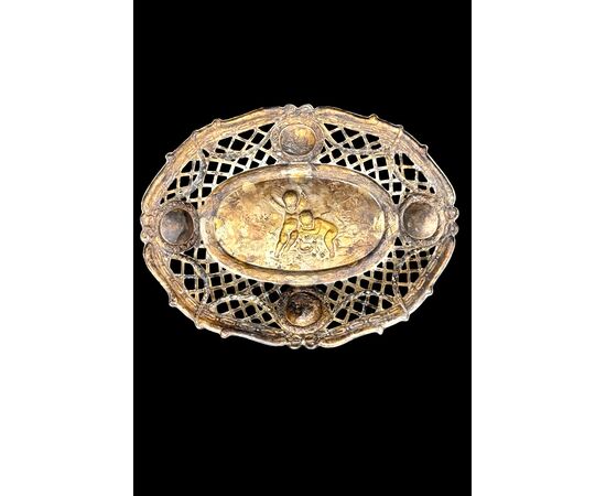 Pierced silver centerpiece with putti and figures. Holland.