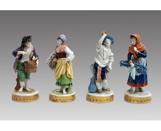 Group of four antique polychrome Capodimonte porcelain sculptures depicting the four seasons. Naples, 19th century.