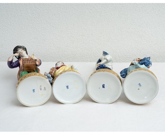 Group of four antique polychrome Capodimonte porcelain sculptures depicting the four seasons. Naples, 19th century.