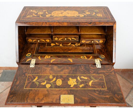 Antique Dutch drop-front desk in fine woods from the early 19th century.