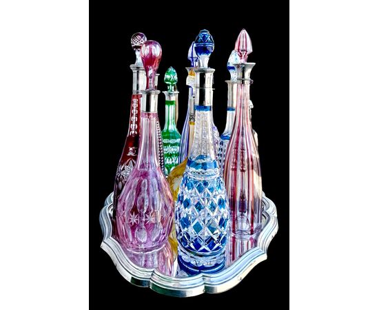 Serie di 11 bottiglie in cristallo molato.Boemia.