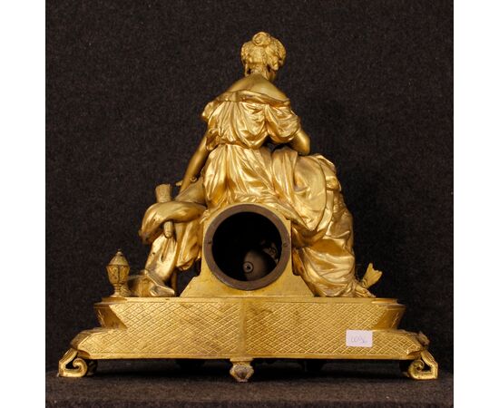 French clock in golden antimony 