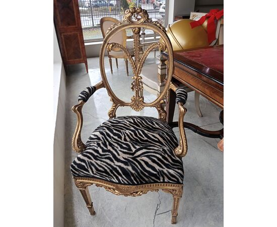 Gilded wood armchair with carved crest
