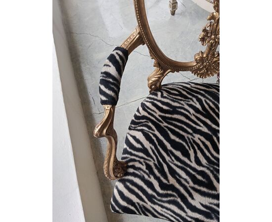 Gilded wood armchair with carved crest