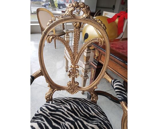 Gilded wood armchair with carved crest