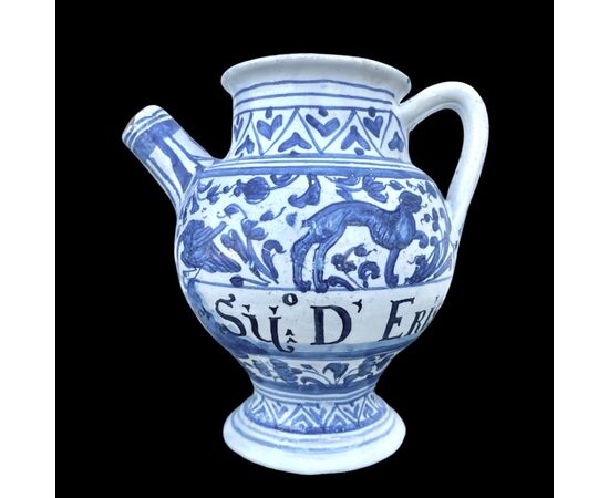 Majolica pouring vessel with turquoise decoration, calligraphic motifs, animal and plant subjects, and the date 1735. Ferniani manufacture, Faenza.