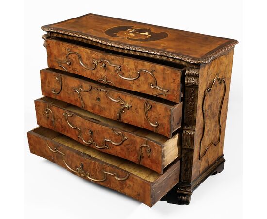 Walnut burl veneered chest of drawers, carved pilasters and gilded "a mecca" frames, rosette with inlaid scene in various woods on the top, Lombardy, 18th century