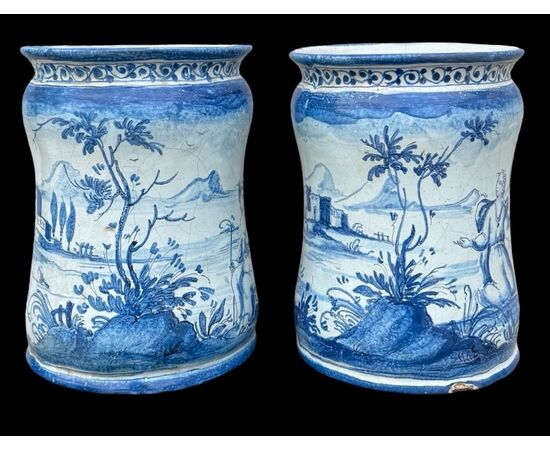 Pair of majolica albarello vases decorated with figures in a rural setting. Lantern signature. Savona.