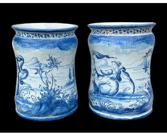 Pair of majolica albarello vases decorated with figures in a rural setting. Lantern signature. Savona.