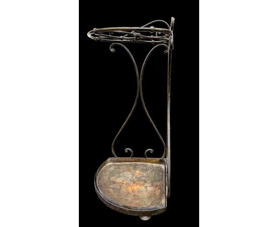 Wrought iron umbrella-cane stand.