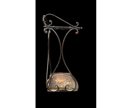 Wrought iron umbrella-cane stand.