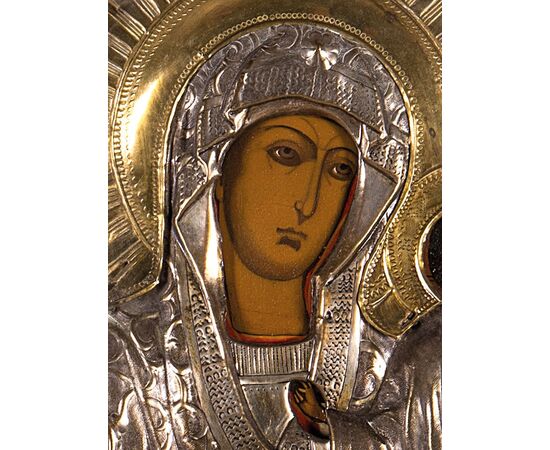 Icon depicting the Madonna and Child, painting on wood panel, embossed silver-plated copper riza, 19th century