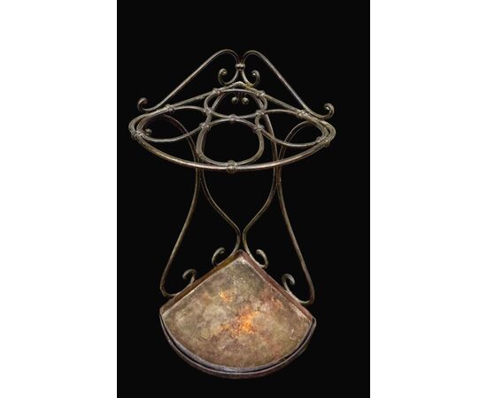 Wrought iron umbrella-cane stand.