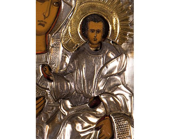 Icon depicting the Madonna and Child, painting on wood panel, embossed silver-plated copper riza, 19th century