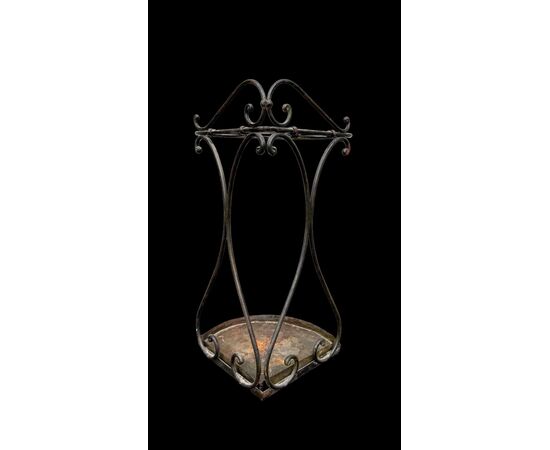 Wrought iron umbrella-cane stand.