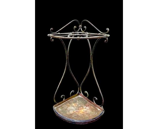 Wrought iron umbrella-cane stand.
