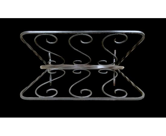 Wrought iron magazine rack.