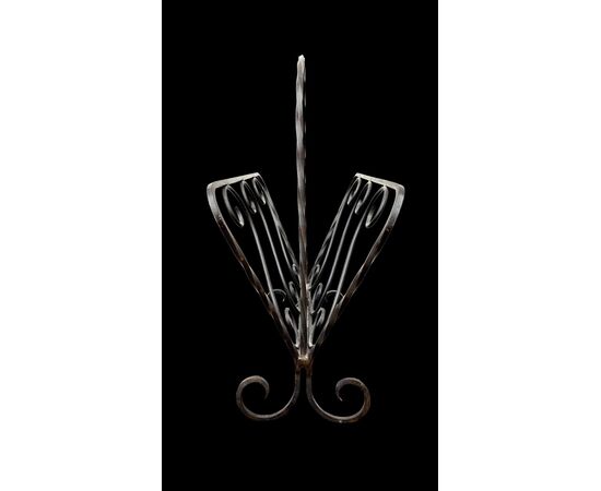 Wrought iron magazine rack.
