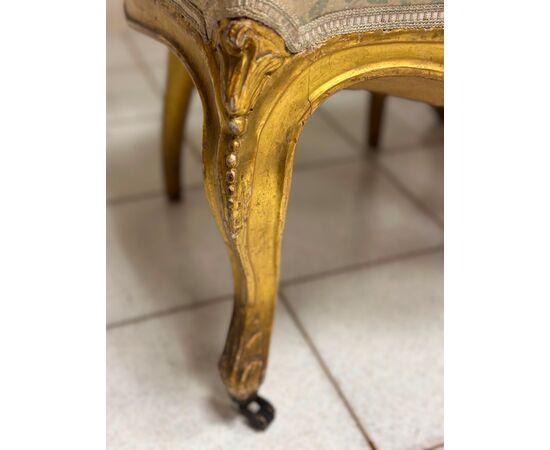 Pair of carved and gilded wooden armchairs. 19th century