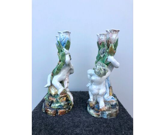 Pair of candlesticks with two burners, with a pair of putti.Minghetti.Bologna manufacture.     