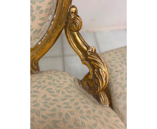 Pair of carved and gilded wooden armchairs. 19th century