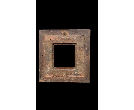 Carved and gilded wooden frame.