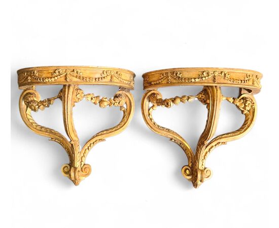 Pair of drop-shaped consoles