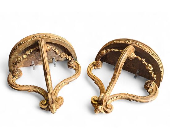 Pair of drop-shaped consoles