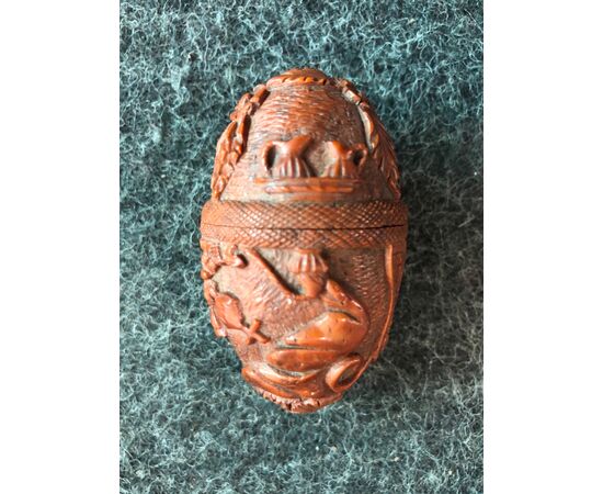 Egg-shaped box in curozo seed with engraved religious scenes. France     