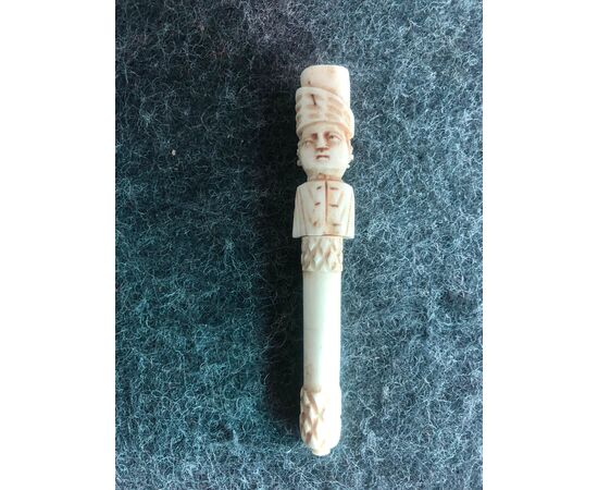 Box Needle holder in bone depicting male figure.Europe     