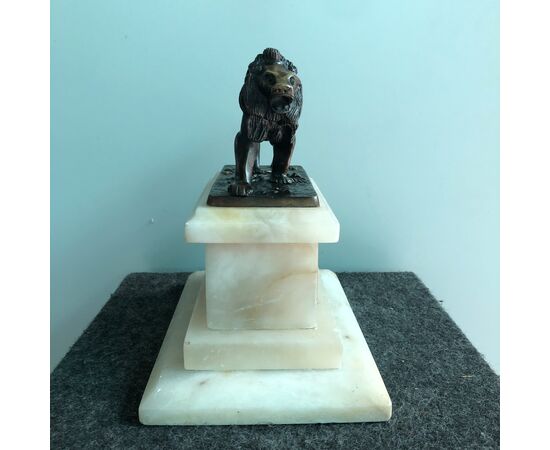 Bronze lion on alabaster basis. France     