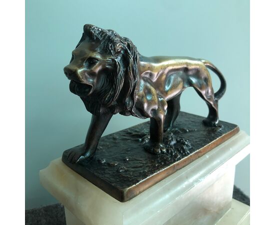 Bronze lion on alabaster basis. France     