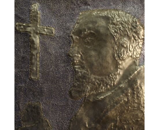 Signed high-relief sculpture in painted metal depicting Padre Pio