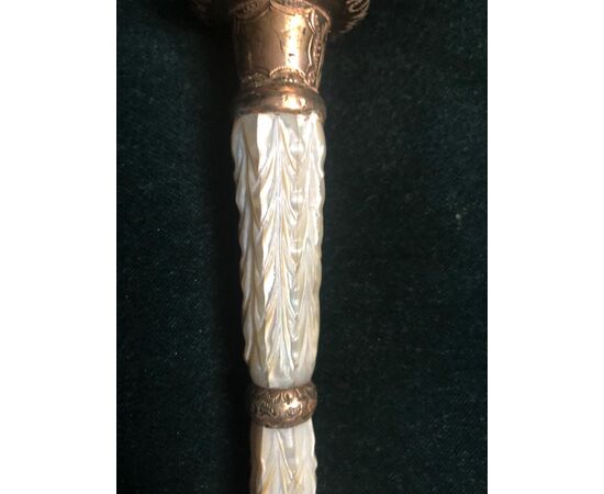 Evening stick with brass knob and mother of pearl. Ebonized wood barrel.     