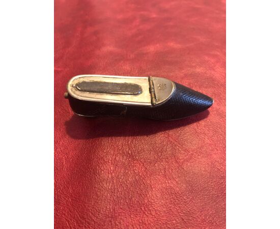 Metal and leather shoe-shaped matchbox.     