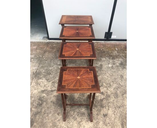 Mahogany coffee table consisting of 4 coffee tables inserted one inside the other with inlaid tops. France.     