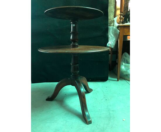 Gueridon walnut coffee table with two shelves and three feet.     