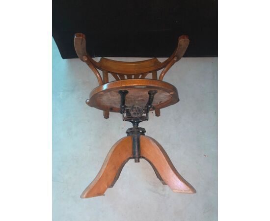Height-adjustable light wood chair.     