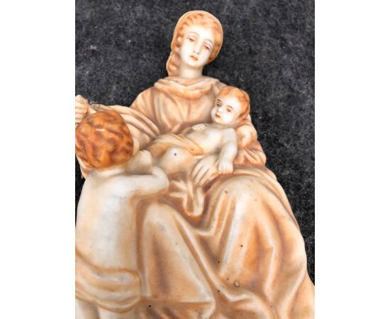 Bisque porcelain stoup with an ocher monochrome figure of Madonna and Child with Saint John. Germany.     