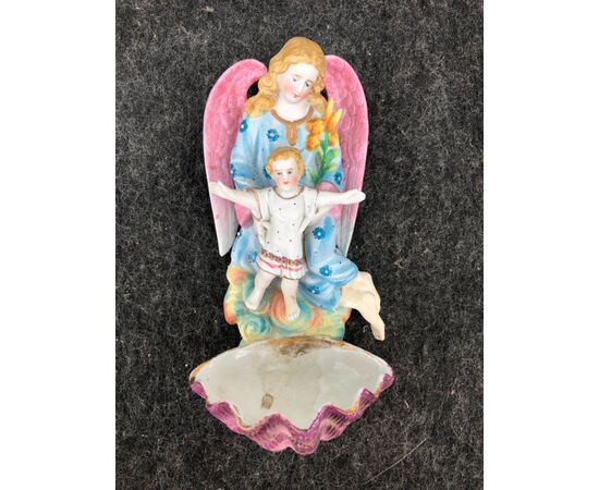 Bisque porcelain holy water stoup with angel figure protecting a boy. France.     
