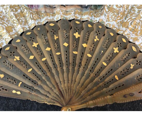Perforated and gilded tortoise fan with paper bunting with watercolor prints with gallant scenes.     
