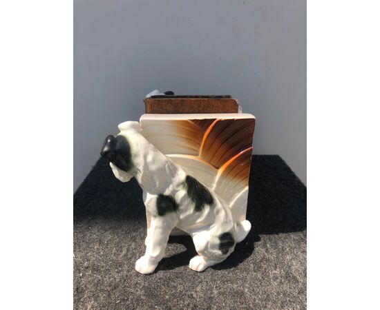 Pair of earthenware bookends depicting pair of dogs.     