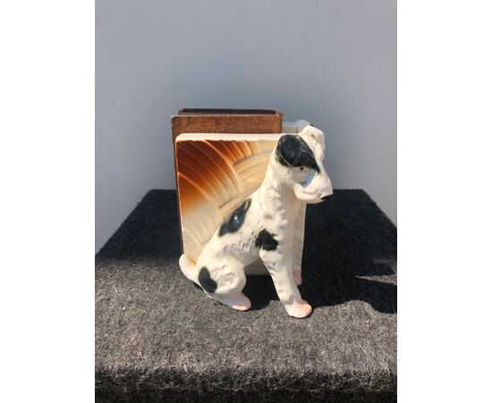 Pair of earthenware bookends depicting pair of dogs.     